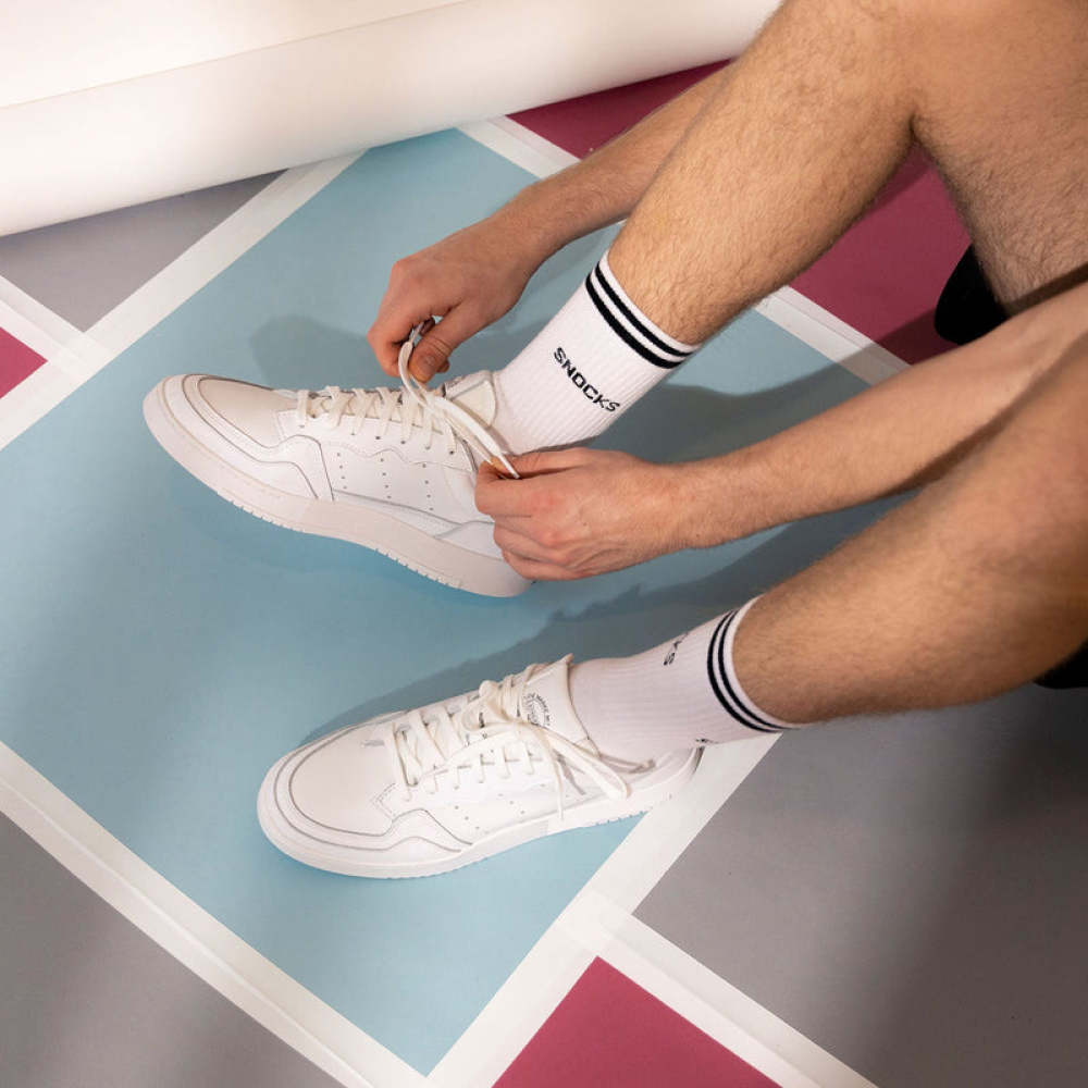 Hohe Sportsocken mit Streifen aus Bio-Baumwolle Weiß